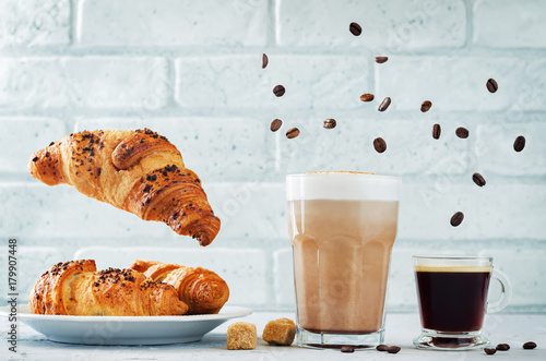 Different types of coffee with flying croissants. Espresso and mocha coffee