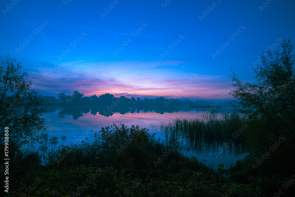 Early morning, dawn over the lake. Misty morning, rural landscape, wilderness, mystical feeling Early morning, dawn over the lake. Misty morning, rural landscape, wilderness, mystical feeling