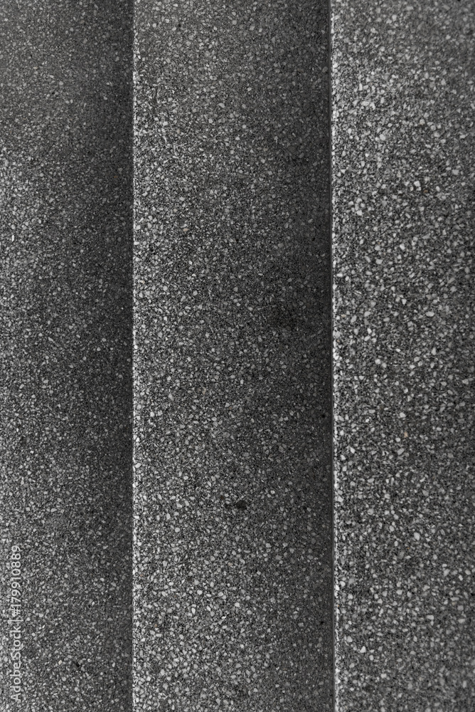 Fototapeta premium Top view of gray gravel stairs. background texture