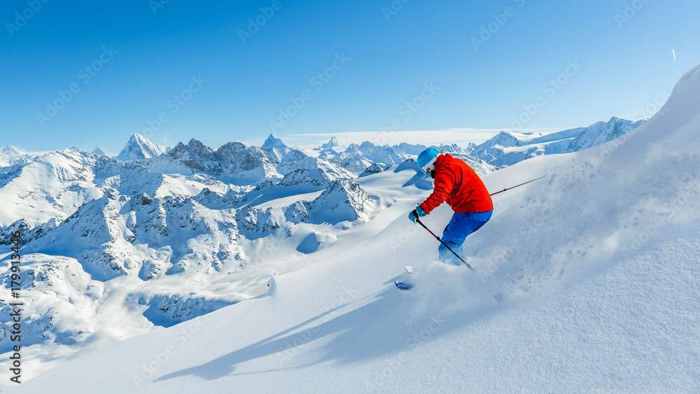 Skiing with amazing view of swiss famous mountains in beautiful winter snow  Mt Fort. The matterhorn and the Dent d'Herens. In the foreground the Grand Desert glacier.