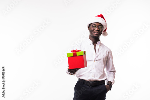 African American male with great smile in santa hat with gift boxes isolated on white