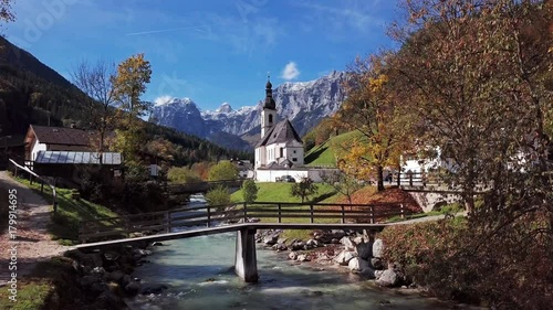 Flight over famous Parish church St. Sebastian, in Ramsau, Berchtesgaden, Bavarian Alps, Germany. photo