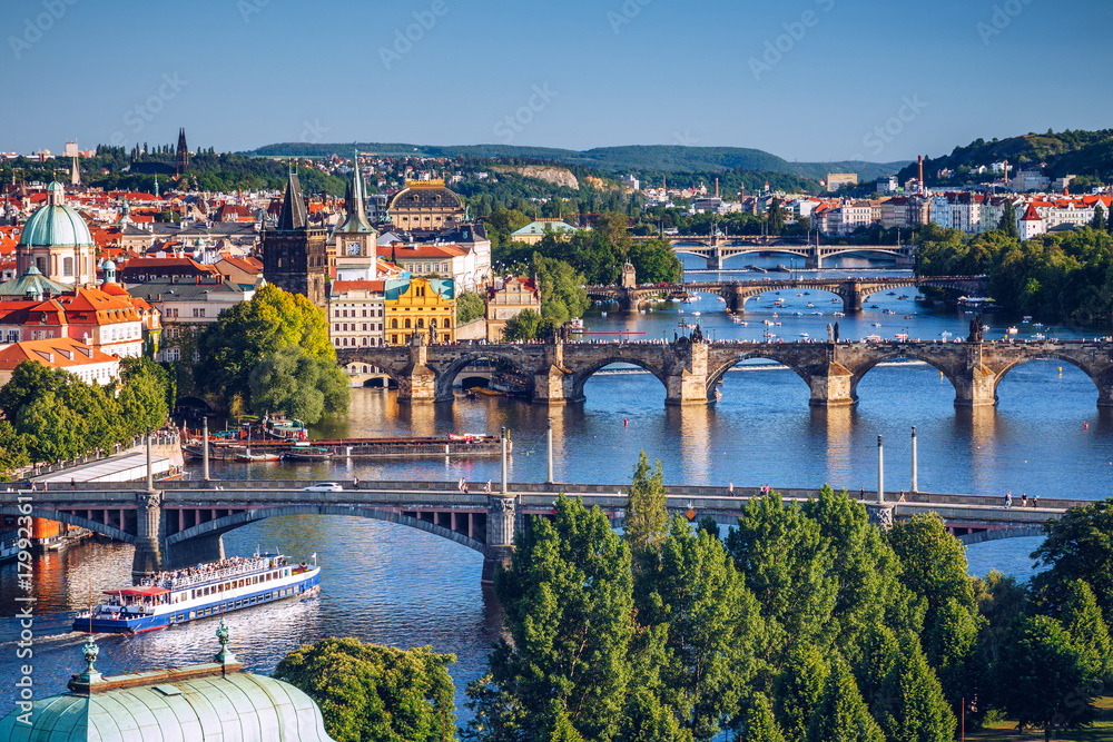 Scenic spring sunset aerial view of the Old Town pier architecture and Charles Bridge over Vltava river in Prague, Czech Republic