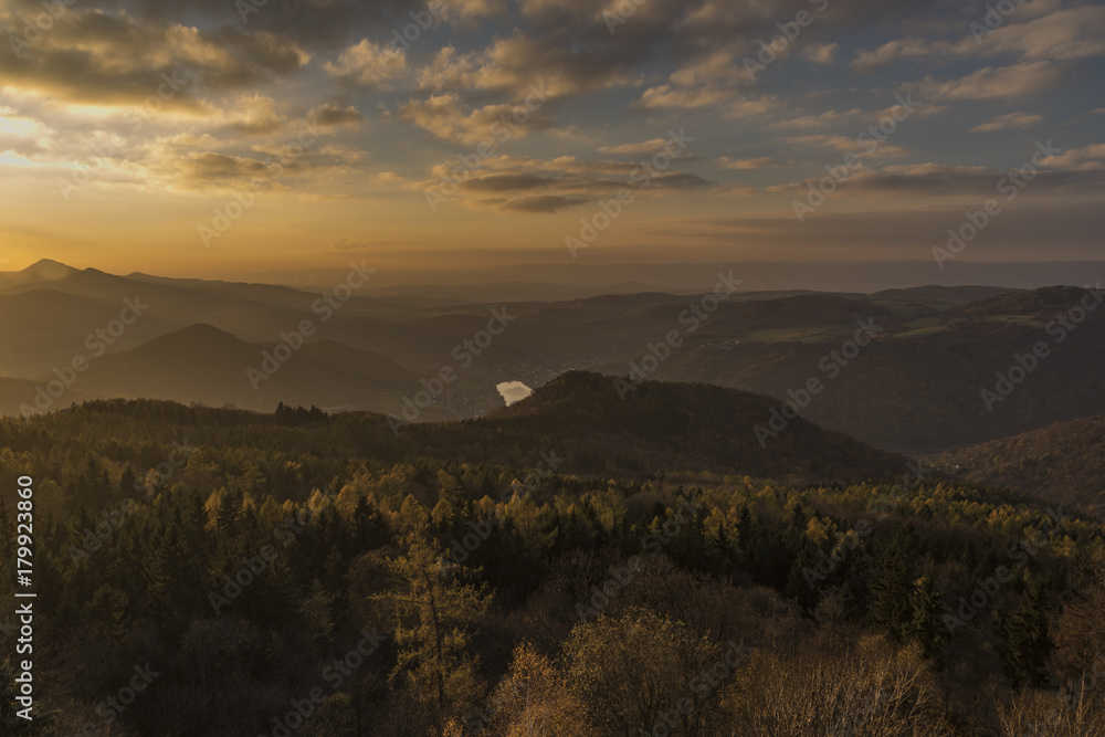 Sunset evening on Varhost hill in Ceske Stredohori mountains Sunset evening on Varhost hill in Ceske Stredohori mountains