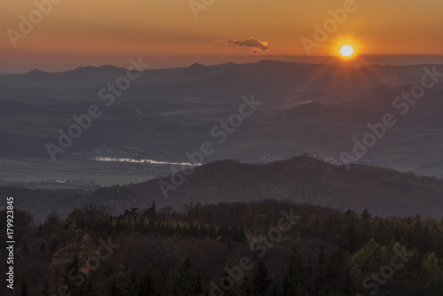 Sunset evening on Varhost hill in Ceske Stredohori mountains photo