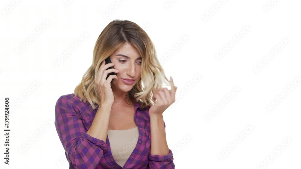 half-turn portrait of adorable smiling woman with trendy hair talking on mobile phone having pleasant conversation over white background copy space. Concept of emotions half-turn portrait of adorable smiling woman with trendy hair talking on mobile phone having pleasant conversation over white background copy space. Concept of emotions