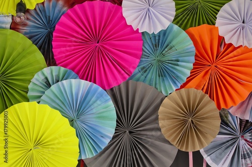 Recycled paper folding umbrella, with multi color, are decorated as background or backdrop.