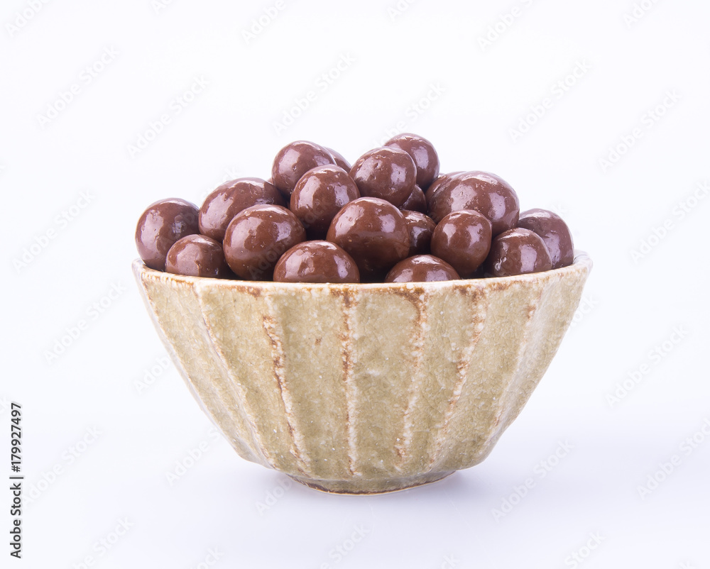 chocolate balls. chocolate balls in bowl on a background chocolate balls. chocolate balls in bowl on a background