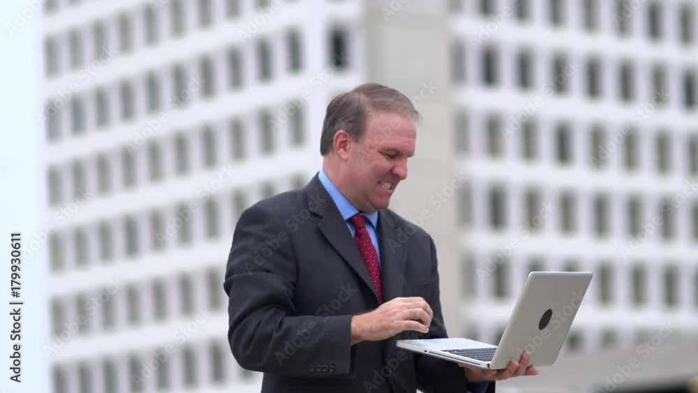 Businessman celebrates good news read from laptop Businessman celebrates good news read from laptop
