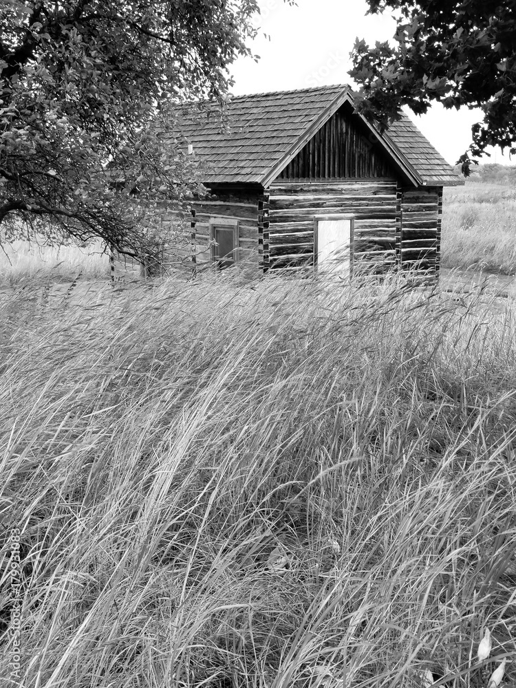 Abandoned weathered barn on a hillside Abandoned weathered barn on a hillside