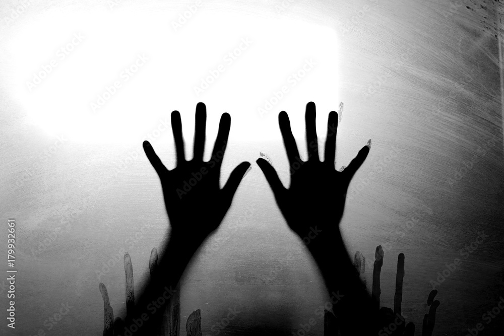 Horror woman hands. Diffused silhouette. Black and white.