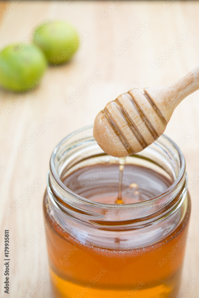 Honey dipper in glass jar. Honey dipper in glass jar.