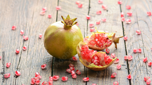 Wallpaper Mural Pomegranate on wooden background Torontodigital.ca