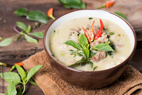 Photos Thai food (Kaeng Khiao Wan),Green curry with pork on wooden background