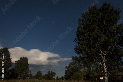 Clouds in the night sky in the light of the moon