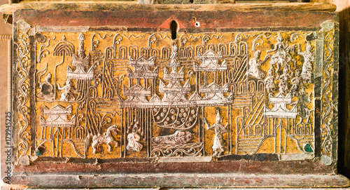 The 19th century Burmese wooden chest with lacquer and gilded gold at Htee Hlaing Monestery, Wundwin town, Mandalay, Myanmar photo