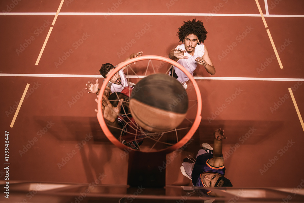 Naklejka premium Guys playing basketball