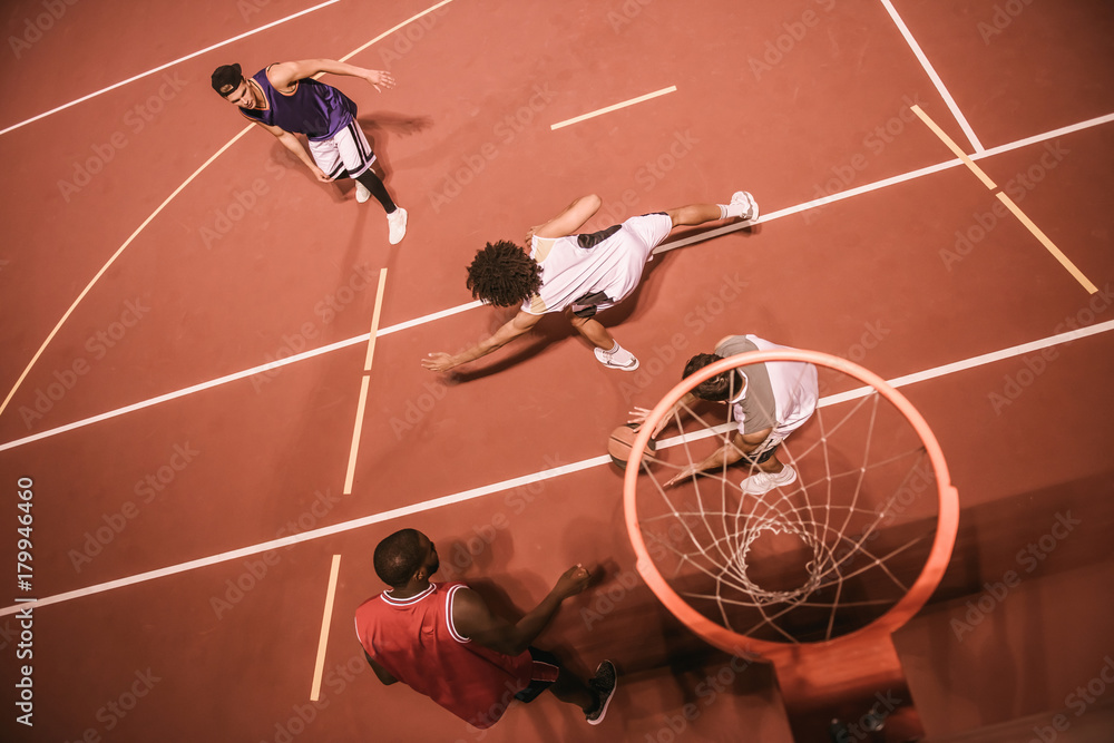 Naklejka premium Guys playing basketball