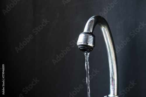 water flowing from opened faucet