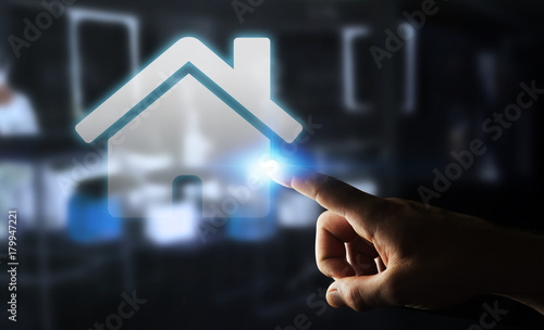 Businessman touching 3D rendering icon house with his finger