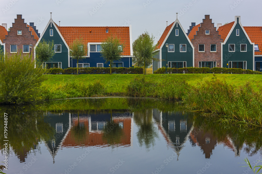 Volendam is a town in North Holland in the Netherlands. Colored houses of marine park in Volendam. North Holland, Netherlands. Volendam is a town in North Holland in the Netherlands. Colored houses of marine park in Volendam. North Holland, Netherlands.