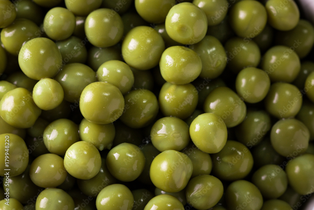 canned Green peas l on old wooden background,healthy vegan food canned Green peas l on old wooden background,healthy vegan food