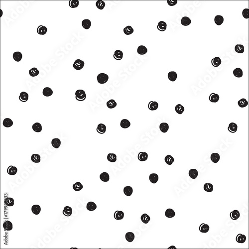 Vintage hand drawn doodle seamless pattern with black dots. Polka dot cute background. Design for paper, wallpaper, textile, fabric, and other projects.