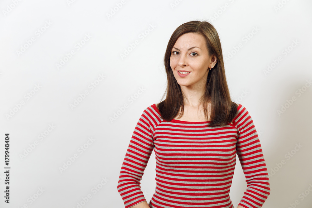 Gorgeous European young happy brown-haired woman with healthy clean skin and charming smile, dressed in casual red and grey clothes, laughing and enjoying on a white background. Emotions concept. Gorgeous European young happy brown-haired woman with healthy clean skin and charming smile, dressed in casual red and grey clothes, laughing and enjoying on a white background. Emotions concept.