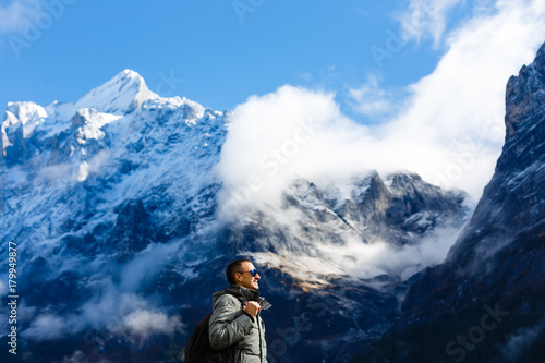 Man in outerwear on a snow-covered mountain © Angelov