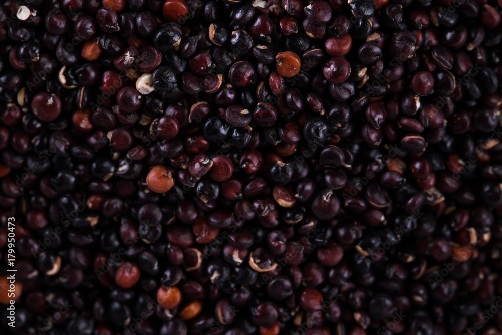 Red, black and white quinoa seeds on a wooden background Red, black and white quinoa seeds on a wooden background