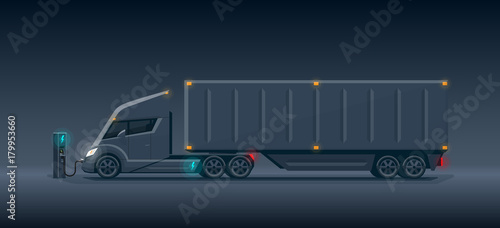 Modern Futuristic Dark Electric Semi Truck with Trailer Charging at Charger Station
