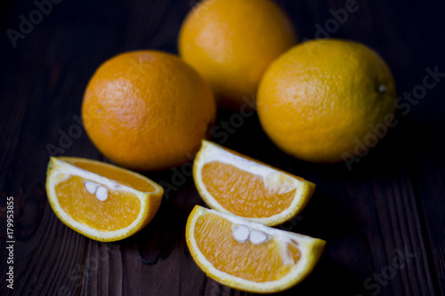 oranges and grapes on wooden background