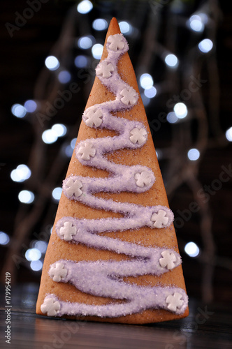 Gingerbread tree on the background of New Year's lights.