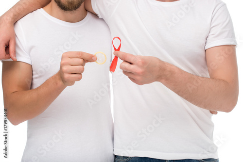 gay couple with aids ribbon and condom