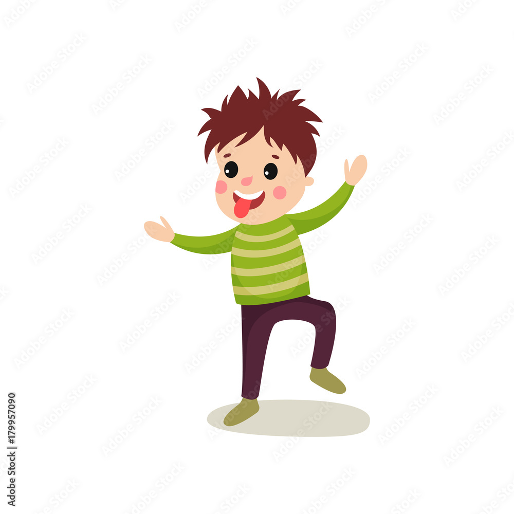 Playful little kid jumping with hands up and making face and showing his tongue Playful little kid jumping with hands up and making face and showing his tongue