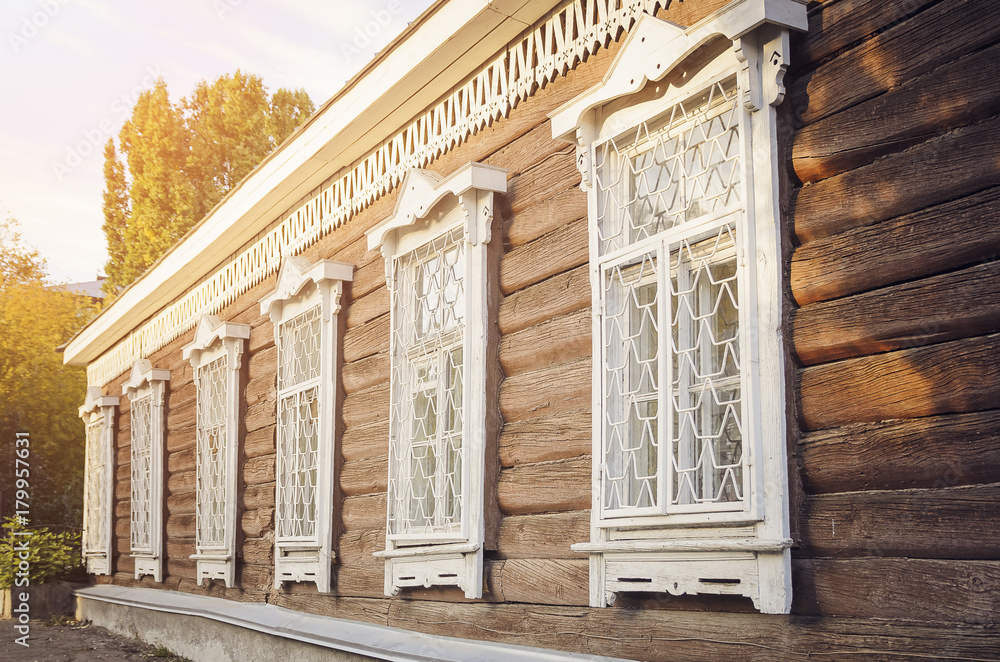Fragment of a beautiful old wooden house. Rustic retro house.