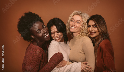 Group of cheerful young women standing together