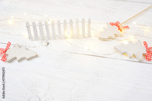 Christmas mock-up or greeting card on white wooden background in rustic style photo