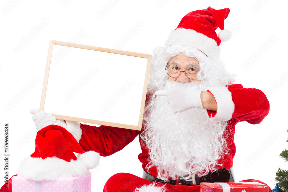 Merry christmas,Santa Claus pointing in white blank sign,Isolated on white background. Merry christmas,Santa Claus pointing in white blank sign,Isolated on white background.