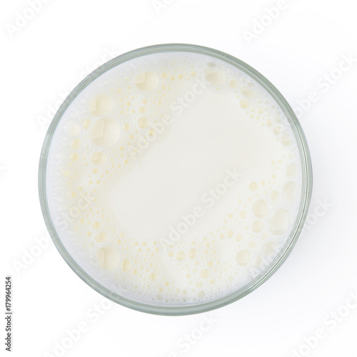 Cup with milk bubble foam isolated on white background top view texture object design