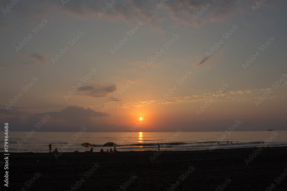 sunset sun ocean. tranquil summer seascape.the bright summer sun reflecting in the waves