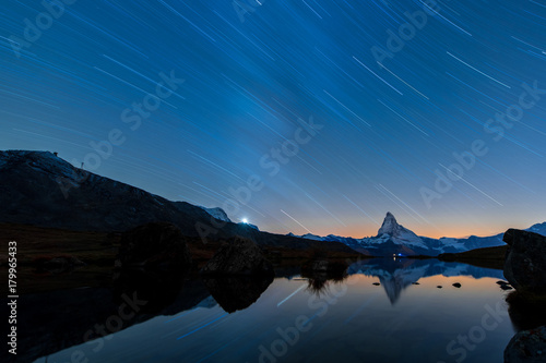 Fototapeta Naklejka Na Ścianę i Meble -  Stunning Matterhorn under moon light with star trail,Stellisee,Valais region,Switzerland,Europe