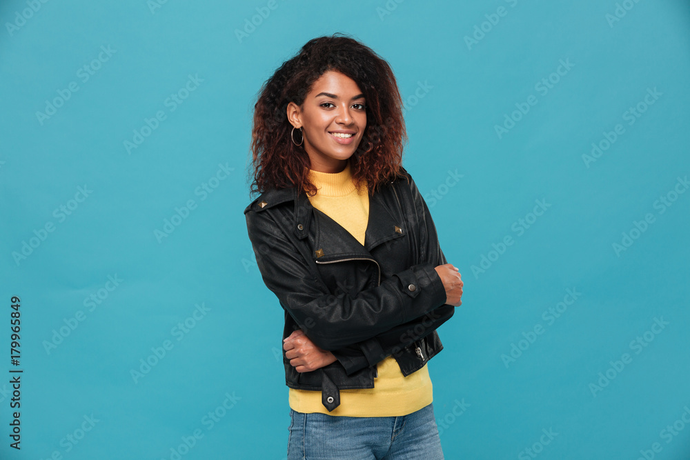 Cheerful beautiful young african woman standing isolated Cheerful beautiful young african woman standing isolated