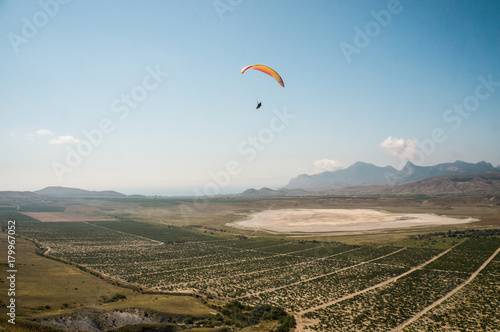 person flying on paraglider