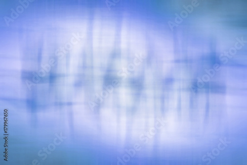 abstract blue background with stripes and light and dark spots