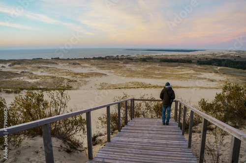 person on wooden pier