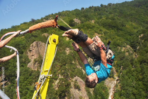 Bungee jumps, extreme and fun sport. Athlete performs tricks