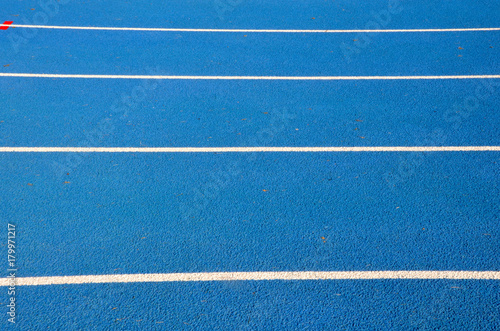 blue running track on athletic stadium