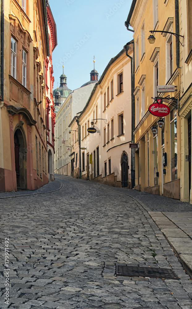 Fototapeta premium OLOMOUC, CZECH REPUBLIC-AUGUST 27, 2017: A narrow and winding street in the old town of Olomouc. Czech Republic. Summer morning view