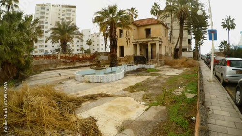 abandoned two-story building on border with closed ghost town Varosha in North Cyprus